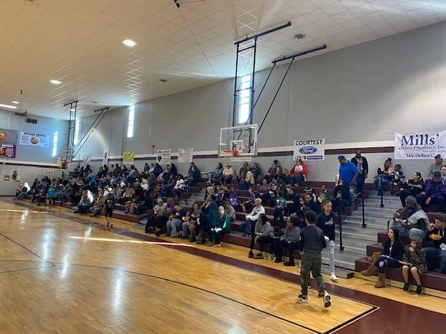 Packed gymnasium at Mills facility