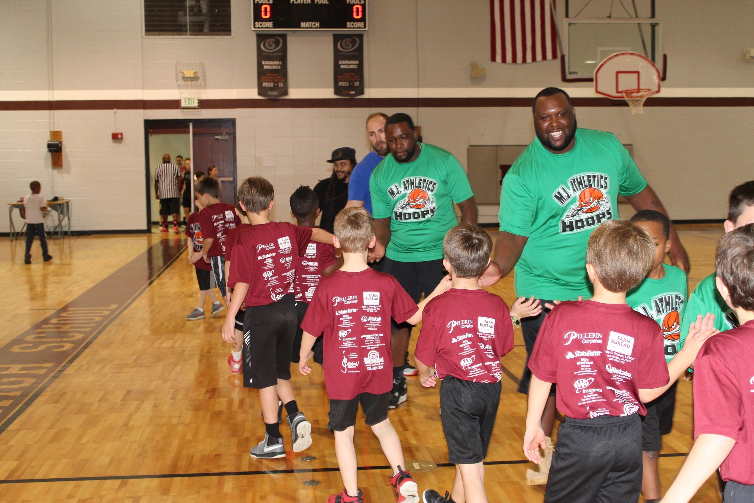D.A. Athletics Hoops coaches with youth players