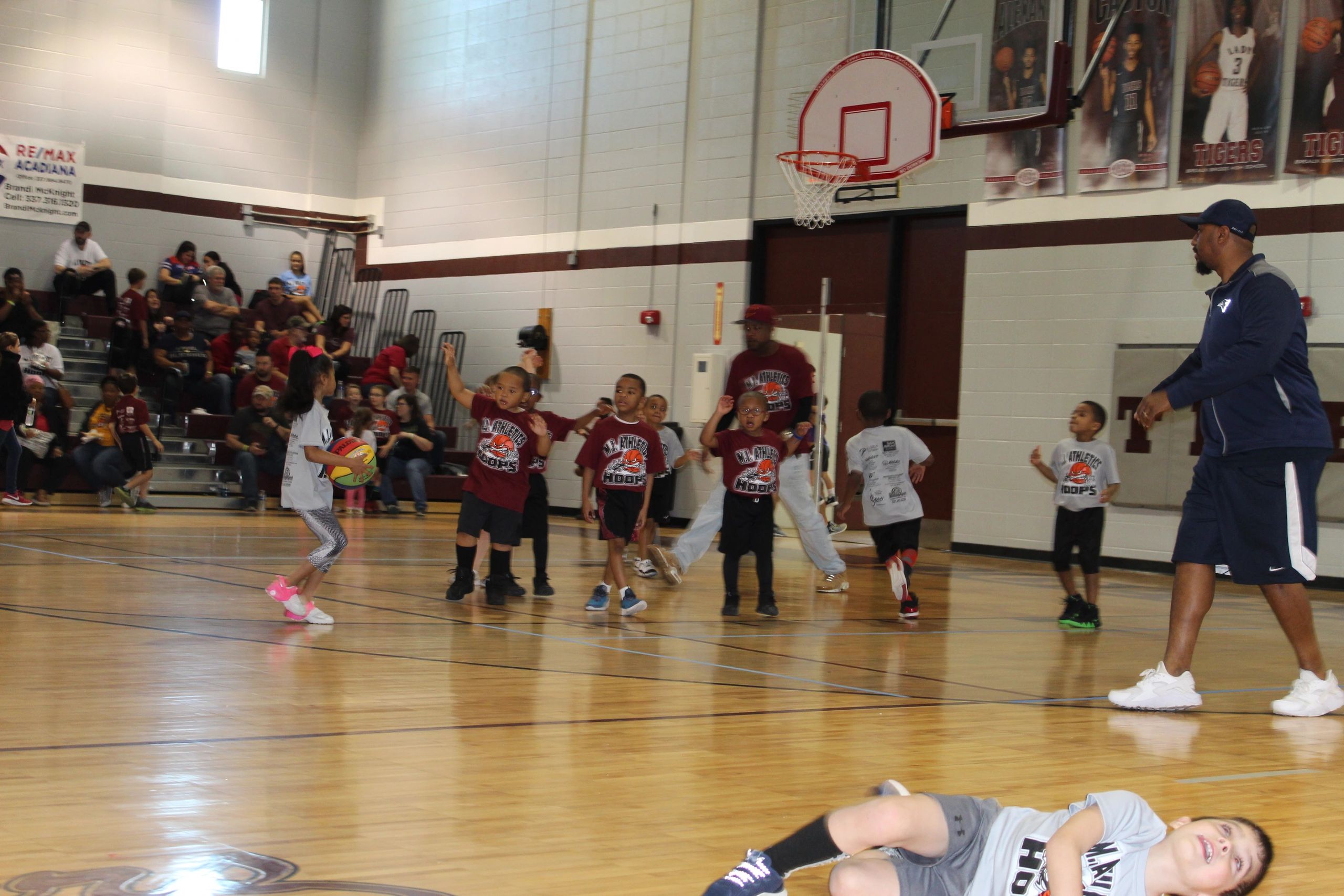 Youth basketball camp session in gymnasium