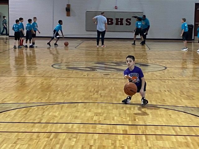 Young player dribbling at BHS gymnasium